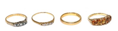 Lot 250 - Two 18 carat gold gemset rings; an 18 carat gold band ring and a 9 carat gold five stone ring