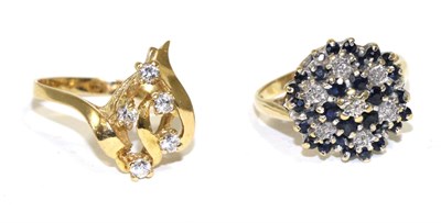 Lot 257 - An 18 carat gold sapphire and diamond cluster ring and a cubic zirconia cluster ring (2)