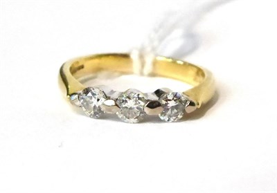 Lot 265 - An 18 carat gold three stone diamond ring, 0.45 carat approx