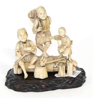 Lot 280 - A Japanese Meiji period ivory okimono of farmers and a child