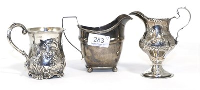 Lot 283 - A silver George III milk jug, a silver Victorian christening mug and a silver George III milk...