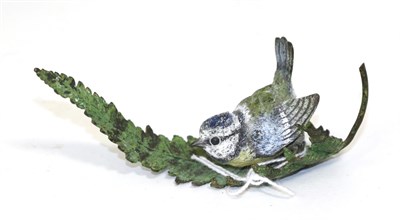 Lot 289 - A small cold painted model of a blue tit perched on a leaf