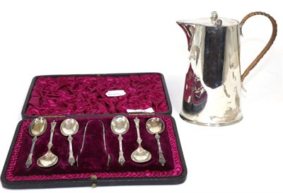 Lot 292 - A silver hot milk jug with cane bound handle, Chester and a set of apostle top spoons,...