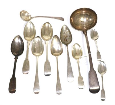 Lot 300 - A group of George II and later silver flatware, mostly fiddle pattern, including a soup ladle,...