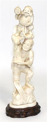 Lot 316 - A Japanese ivory okimono, Meiji period, as a man holding scrolls and a figure on a cloud scroll...