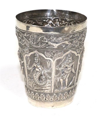 Lot 318 - An Indian white metal beaker, early 20th century, decorated in relief with figures and animals...