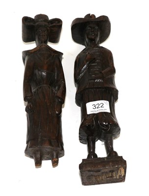 Lot 322 - A pair of Dutch carved oak figures of a lady and gentleman, 17th century, standing wearing...