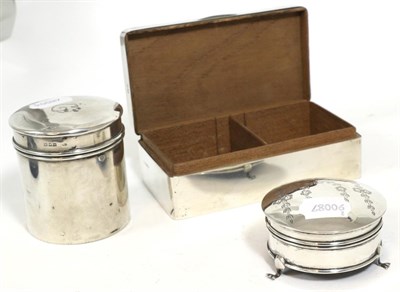 Lot 324 - A silver cigarette box, silver box and cover and a dressing table silver hinged engraved box...