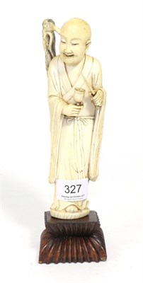 Lot 327 - A Japanese Meiji period ivory okimono