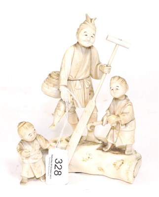 Lot 328 - A Japanese ivory figure group, early 20th century, as a fisherman and two boys, signed