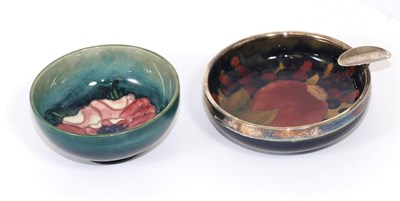 Lot 341 - Moorcroft pottery Pomegranate pattern ashtray with plated rim and Anemone pattern bowl (2)