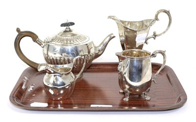 Lot 354 - An early Victorian Elkington & Co silver teapot and three various silver cream jugs