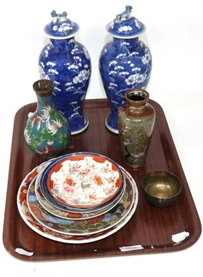 Lot 362 - A group of oriental ceramics including a pair of Chinese blue and white prunus patterned vases...