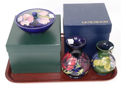 Lot 366 - A Moorcroft Anemone vase, another Moorcroft vase and a Moorcroft bowl and cover (3)