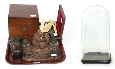 Lot 370 - A group including a black forest inkwell carved with bears, a glass dome, travelling apothecary...