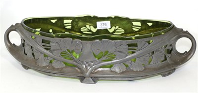 Lot 376 - A continental art nouveau pewter twin handle centre bowl with green glass liner