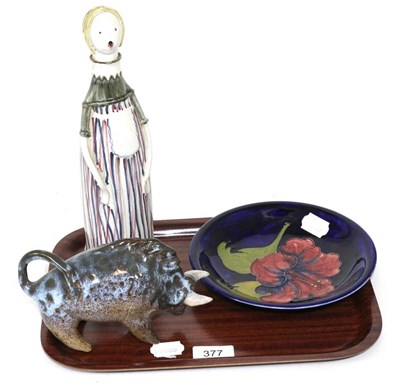 Lot 377 - A Moorcroft Hibiscus pattern dish, a Rye Pottery figural decanter and a studio pottery model of...