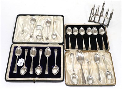 Lot 386 - Two sets of six cased silver teaspoons; a silver toast rack; set of six coffee spoons; plus...