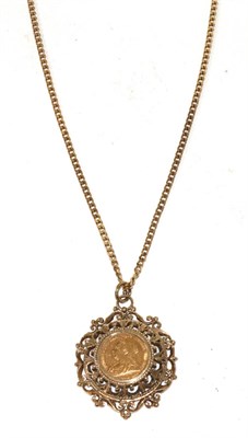 Lot 393 - An 1895 full sovereign in a 9 carat gold frame and a 9 carat gold chain