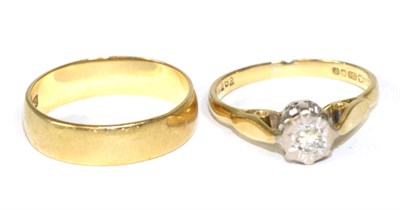 Lot 394 - An 18 carat gold band ring and an 18 carat gold diamond solitaire ring