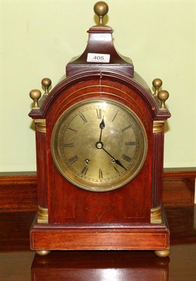 Lot 405 - A Regency style inlaid striking mantel clock