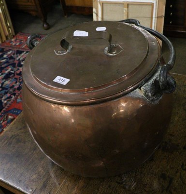 Lot 415 - A large 19th century copper cauldron with lid and iron handle