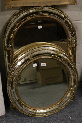 Lot 451 - A pair of circular mirrors and a matching pair of arched mirrors (4)