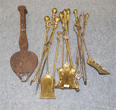 Lot 480 - A collection of assorted brass fire irons, bellows etc