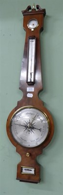 Lot 570 - A Victorian mahogany wheel barometer, spirit level dial signed