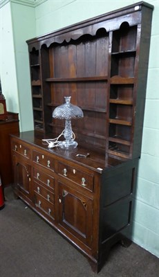 Lot 573 - An 18th century oak dresser and rack