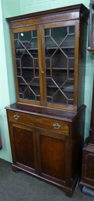 Lot 580 - A mahogany astragal glazed bookcase cabinet