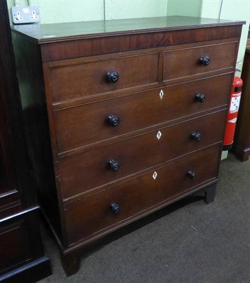 Lot 581 - A George III oak chest of drawers