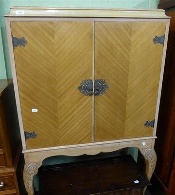 Lot 587 - A 1950's cocktail cabinet