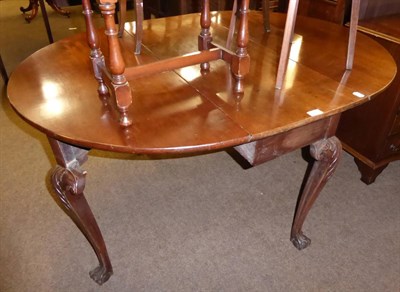 Lot 594 - An 18th century mahogany gate leg table on claw and ball feet