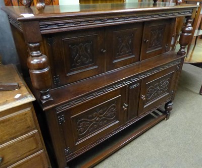 Lot 599 - An oak court cupboard