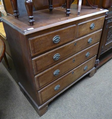 Lot 600 - An oak four height chest of drawers