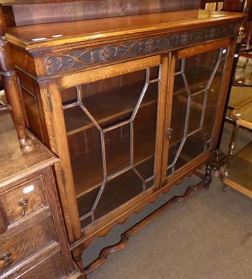 Lot 603 - An oak astragal glazed bookcase