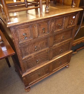 Lot 604 - An oak four height chest of drawers in period style