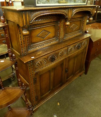 Lot 609 - A reproduction oak court cupboard