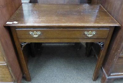 Lot 619 - An early 19th century oak side table fitted with a drawer