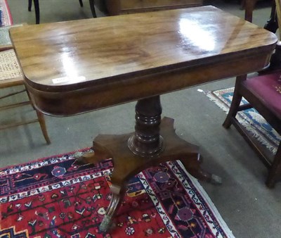 Lot 622 - A 19th century mahogany fold over tea table