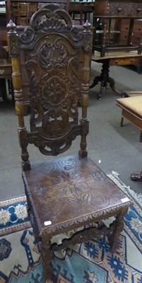 Lot 625 - A period style carved oak hall chair