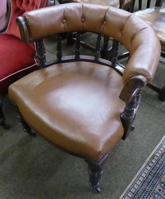 Lot 651 - A Victorian mahogany smoker's bow chair, button-back leather upholstery