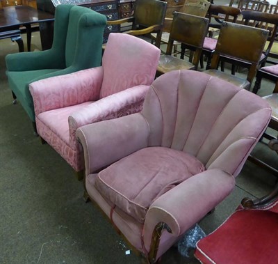 Lot 653 - A green upholstered wing back armchair, a pink upholstered low wing armchair and another pink...