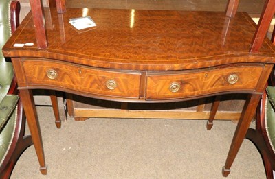 Lot 671 - An Edwardian mahogany serpentine sideboard