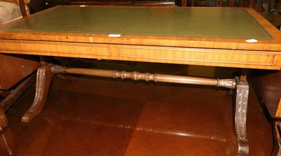 Lot 680 - A reproduction leather inset drop leaf coffee table