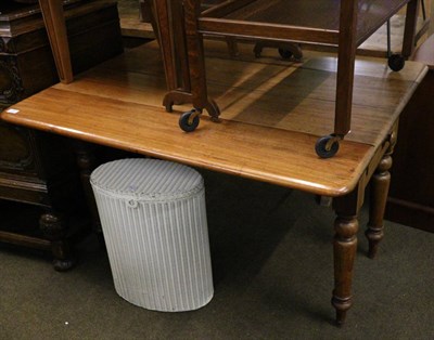 Lot 689 - A farmhouse drop leaf table fitted with a drawer