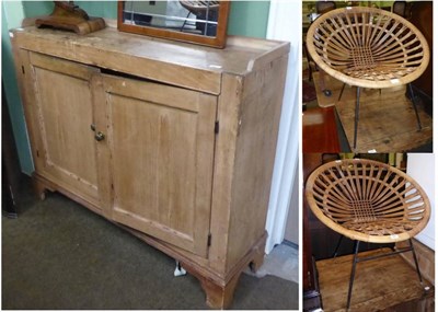 Lot 697 - Two Habitat style rattan basket chairs together with a pine cupboard