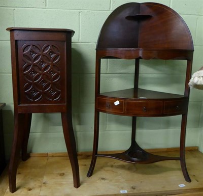 Lot 707 - A mahogany corner washstand and a carved wooden planter