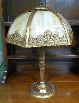 Lot 722 - An early 20th century American gilt metal table lamp, with a domed mottled coloured glass sectional